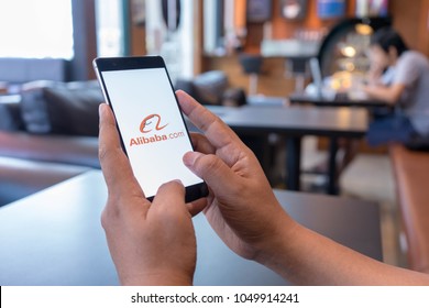 CHIANG MAI, THAILAND - Mar 18,2018: Man hands holding HUAWEI with alibaba apps on screen. Alibaba the the world biggest online commerce company. Its three main sites Taobao,Tmall and Alibaba. - Shutterstock ID 1049914241