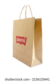 .Chiang Mai, Thailand, March 4, 2022. Brown Paper Shopping Bagswith Levi´s Logo Isolated On White Background.