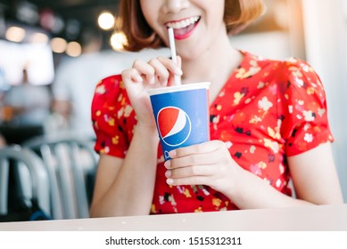 Chiang Mai, Thailand : May 15,2019: Young Woman Hand Holding Drink Pepsi In Restaurant.