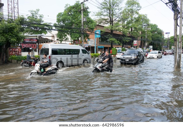 CHIANG MAI THAILAND - MAY 19 2017 : Flooding in\
Chiangmai city.Flooding of Kad Luang market,Night Bazaar and\
downtown near the Ping River,effect of heavy raining  on MAY\
19,2017 in Chiangmai,\
Thailand