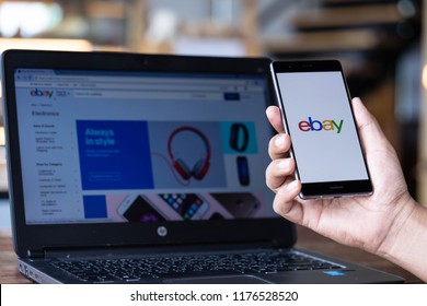 CHIANG MAI, THAILAND - Sep. 08,2018: Man hands holding HUAWEI with eBay apps on the screen. eBay is one of the most popular ways to buy and sell goods and services on the internet.