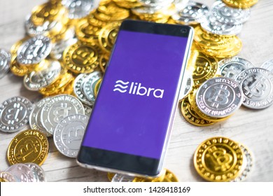 CHIANG MAI,THAILAND - JUNE 6,2019: Libra new digital currency facebook coins on mobile phone screen Online Crypto currency business concept.
