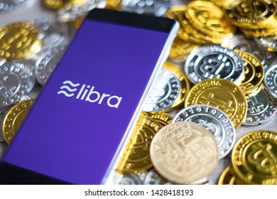 CHIANG MAI,THAILAND - JUNE 6,2019: Libra new digital currency facebook digital currency on mobile phone screen facebook cryptocurrency coins concept.