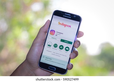 Chiang Mai,Thailand - March 1, 2017: Smartphone Samsung Galaxy S6 open apps instagram application on the screen on the desk. - Shutterstock ID 590527499