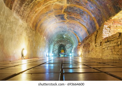 CHIANG MAI,THAILAND-CIRCA APR 2017: The Golden Buddha image in the brick old cave or tunnel in Umong Temple in chiang mai thailand with lighting 