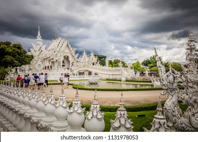 Chiang Rai (Thailand) - 10 June 2017: People Are Visiting The Wat Rong Khun, Better Known As The White Temple, A Contemporary And Unconventional Buddhist Temple In Chiang Rai Province 
