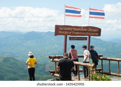 Chiang Rai / Thailand / 21-06-2019. Teens stand to see the scenery of clouds and mountains along the Thai-Burma border.