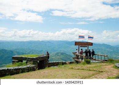 Chiang Rai / Thailand / 21-06-2019. Teens stand to see the scenery of clouds and mountains along the Thai-Burma border.