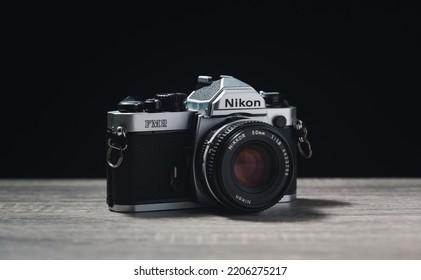 Chiang Rai Thailand, CA - April 10, 2022: A Nikon Camera, No Longer Manufactured With A Film Canister On Wooden Background.