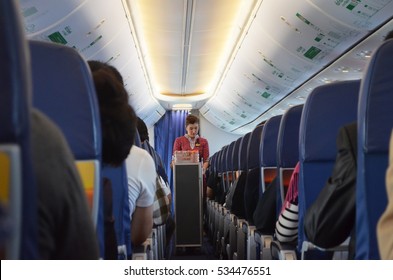 CHIANG RAI, THAILAND - DECEMBER 12, 2016: An Air Hostage Or Air Crew Is Serving Drink And Snack To Passengers In The Flight From Chiang Rai To Bangkok, Thailand.