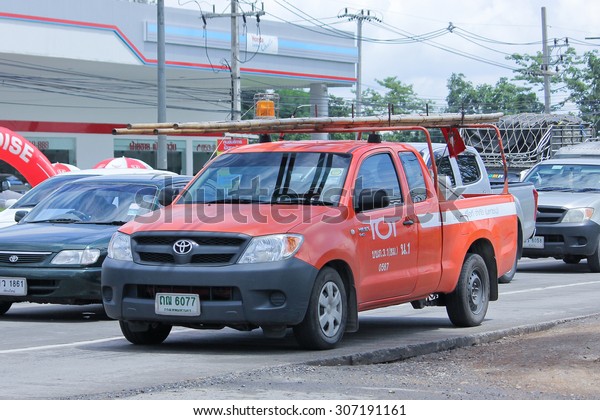 CHIANGMAI, THAILAND -AUGUST\
8 2015:  Pickup truck of Tot company.Intenet and Telephone Service\
in Thailand. Photo at road no.121 about 8 km from downtown\
Chiangmai, thailand.
