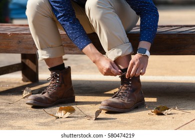 CHIANGMAI , THAILAND - FEB 16 2017: Man Tying His Boot While Wearing Apple Watch.