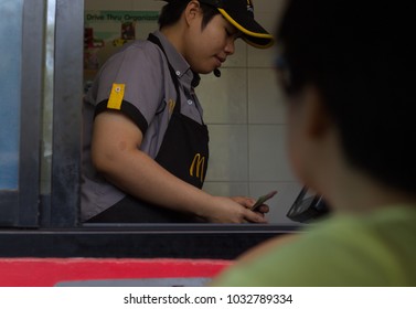 CHIANGMAI, THAILAND - February 25, 2018;  A Drive-thru Customer Is Paying To A McDonald’s Employee Through The Window Without Leaving Her Car