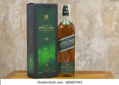 CHIANGMAI , THAILAND - JUL 29 2017: Johnnie Walker Green Label whiskey with box and papers in The Table