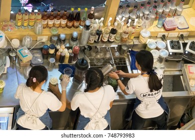 Chiangmai, Thailand - July 8, 2017: A Part Time Young Student Working At Coffee Shop On School Holiday.