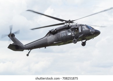 Chiangmai, Thailand. June 24, 2017. Helicopter Of Royal Thai Army Sikorsky UH 60 Black Hawk Hovering Over Helipad With Beautiful Cloud. 