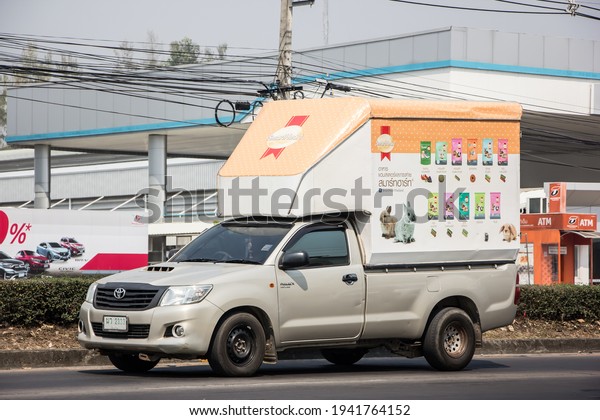Chiangmai, Thailand - March  2 2021:\
Container Truck for Cat food Transportation. Photo at road no.121\
about 8 km from downtown Chiangmai,\
thailand.