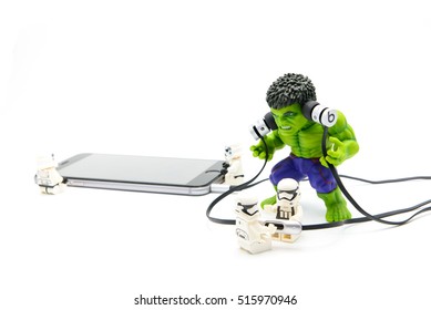 Chiangmai, Thailand - November, 15, 2016 : Lego Group Of Stormtrooper While Playing Music From Smartphone Through The Headset To The Green Hulk Who Are Angry.Theme Relax.