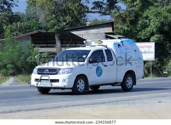 CHIANGMAI,\
THAILAND - NOVEMBER 27 2014: Mini truck of TT&T company.\
Intenet and Telephone Service in Thailand. Photo at road no 121\
about 8 km from downtown Chiangmai,\
thailand.