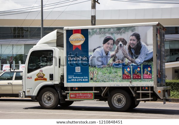 Chiangmai, Thailand - September 25\
2018: Container Truck for Cat food Transportation. Photo at road\
no.121 about 8 km from downtown Chiangmai,\
thailand.