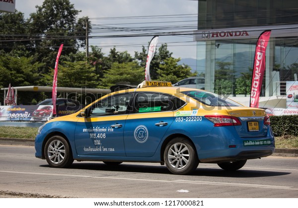Chiangmai, Thailand - September\
27 2018:  City taxi Meter chiangmai, Nissan Sylphy, Service in\
city. Grab Service. On road no.1001, 8 km from Chiangmai Business\
Area.