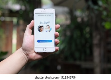 CHIANGMAI,THAILAND - NOV 02,2016 : A hand holding Apple iPhone 6 plus with Tinder application. Tinder is a location-based dating and social discovery service application