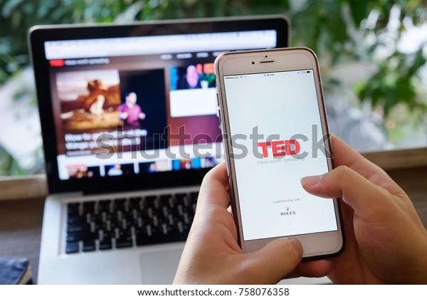 CHIANGMAI,THAILAND - NOV\
20,2017 : A hand holding Apple iPhone 6 plus with shows icon TED\
talk application,TED talk is a popular application video icon\
talking about for\
people.