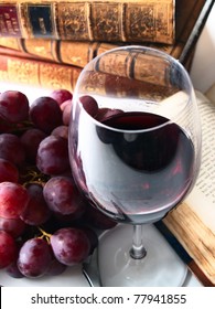 Chianti Reserve Wine, Glass, Grapes And Old Books