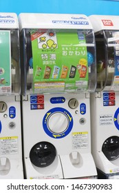 CHIBA, JAPAN - 1 August, 2019: Close-up of so-called gashapon toy vending machines (toys come in a plastic capsule). It contains small cases based on designs of Kikkoman flavored soy milk cartons.