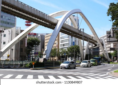 CHIBA, JAPAN - July 10, 2018: View Of Traffic Below A Section Of Chiba City Urban Monorail Tracks Which Are Supported By Large Arches.