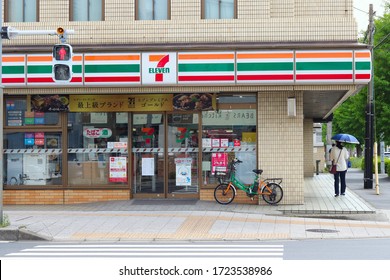 CHIBA, JAPAN - May 5, 2020: A 7-Eleven Convenience Store On A Street Corner In Chiba Prefecture's Urayasu City. A Store Electric Bicycle Is Parked Outside.