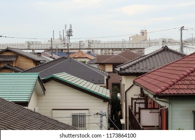 CHIBA, JAPAN - September 6, 2018: View Of Rooftops In Suburban Chiba City. The Chiba Urban Monorail Can Be Seen In The Distance.