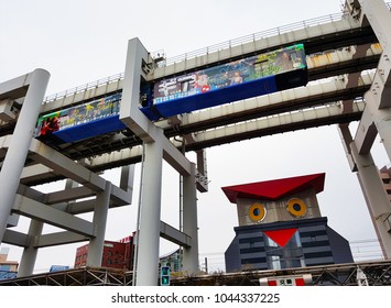 Chiba, JP - DECEMBER 31, 2017: The Chiba Urban Monorail Train That Cruising Over Traffic On A Main Road In Central Chiba City.