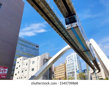 Chiba, JP - OCTOBER 1, 2019: The Chiba Urban Monorail Train That Cruising Over Traffic On A Main Road In Central Chiba City.