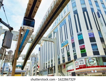 Chiba, JP - OCTOBER 1, 2019: The Chiba Urban Monorail Train That Cruising Over Traffic On A Main Road In Central Chiba City.