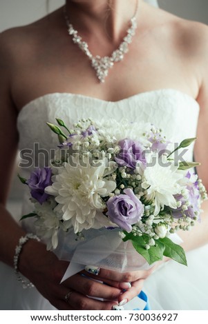chic bouquet in the hands of the bride