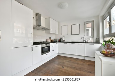 Chic Compact Kitchen With Glossy White Furniture And All Necessary Appliances