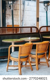 Chic Dining Setup. Elegant Cafe Environment Featuring Plush Cushions And Refined Ambiance