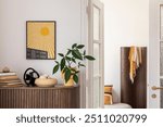 Chic entryway with mock up yellow artwork, natural wood textures, and modern decor, creating a welcoming and vibrant space. Home decor.