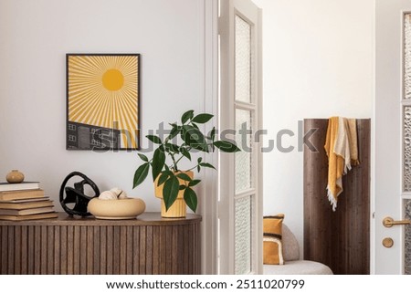 Chic entryway with mock up yellow artwork, natural wood textures, and modern decor, creating a welcoming and vibrant space. Home decor.