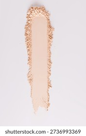 A chic example of the texture of a compact powder in a natural tone. texture of decorative cosmetics. copy space. A sample to advertise your product. vertical top view