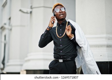 black suit with gold chain