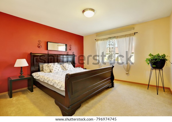 Chic Master Suite Red Accent Wall Royalty Free Stock Image