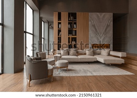 chic modern design of a dark expensive interior of a luxurious country house with huge panoramic windows and a magnificent view of the divine forest