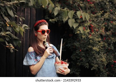 
Chic Retro Woman Drinking Natural Cherry Juice. Fashionable Girl Having An Organic Freshly Squeezed Fruity Beverage
