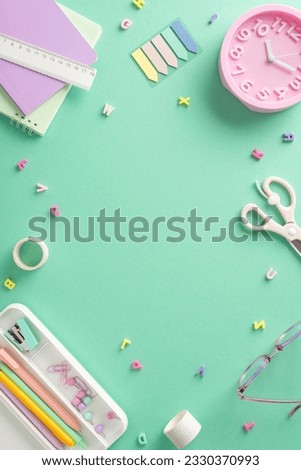 Chic school supplies composition. Vertical top view of girly-themed stationery, planners, pencil case, pens, sticky notes, scissors, ruler, clock, letters on teal background. Frame for text or advert