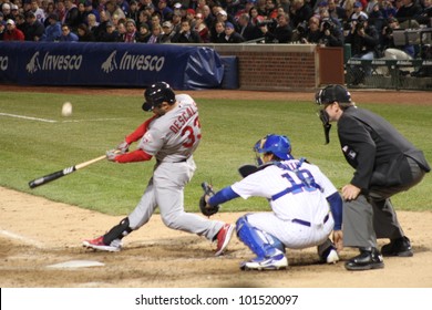 CHICAGO - APRIL 25: Daniel Descalso Of The St. Louis Cardinals Hits A Ball During A Game Against The Chicago Cubs At Wrigley Field On April 25, 2012 In Chicago, Illinois.