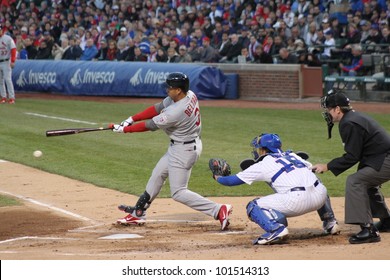 CHICAGO - APRIL 25: Skip Schumaker Of The St. Louis Cardinals Hits A Ball During A Game Against The Chicago Cubs At Wrigley Field On April 25, 2012 In Chicago, Illinois.