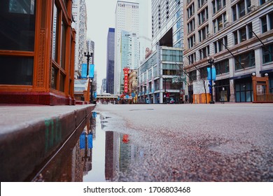                   Chicago - April 4, 2020:  Chicago's State Street Facing The Chicago Theater Sign During The Coronavirus Pandemic With Empty Streets.           