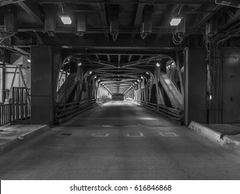 Chicago bridge under overpass roadway with steel girders and rivets